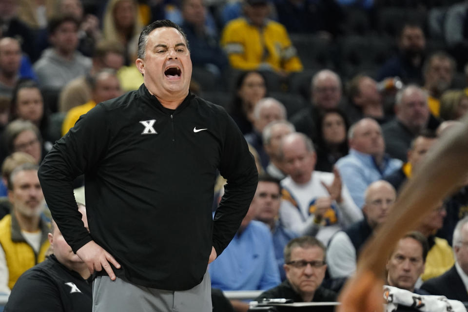 Xavier head coach Sean Miller shouts from the sideline during the first half of an NCAA college basketball game against Marquette Wednesday, Feb. 15, 2023, in Milwaukee. (AP Photo/Aaron Gash)