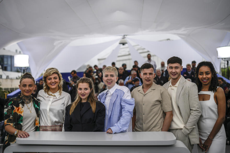 Laura Ambler, from left, Lara Peake, Mia Mckenna-Bruce, director Molly Manning Walker, Shaun Thomas, Samuel Bottomley and Enva Lewis pose for photographers at the photo call for the film 'How To Have Sex' at the 76th international film festival, Cannes, southern France, Friday, May 19, 2023. (AP Photo/Daniel Cole)