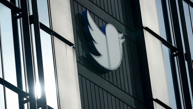 A Twitter logo hangs outside the company’s offices in San Francisco, Dec. 19, 2022. A judge ruled that some departments and individuals in the Biden administration cannot contact social media companies about discouraging or removing content. 