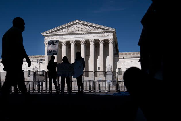 A small group of abortion-rights supporters gather in front of the Supreme Court on June 28 in Washington. (Photo: Nathan Howard via Getty Images)