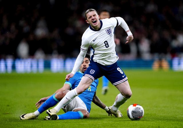 Brazil’s Lucas Paqueta, left, fouls England’s Conor Gallagher