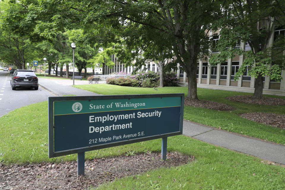 This photo shows a sign at the headquarters for Washington state's Employment Security Department Tuesday, May 26, 2020, at the Capitol in Olympia, Wash. Washington state's rush to get unemployment benefits to residents who lost jobs due to the coronavirus outbreak left it vulnerable to criminals who made off with hundreds of millions of dollars in fraudulent claims. (AP Photo/Ted S. Warren)