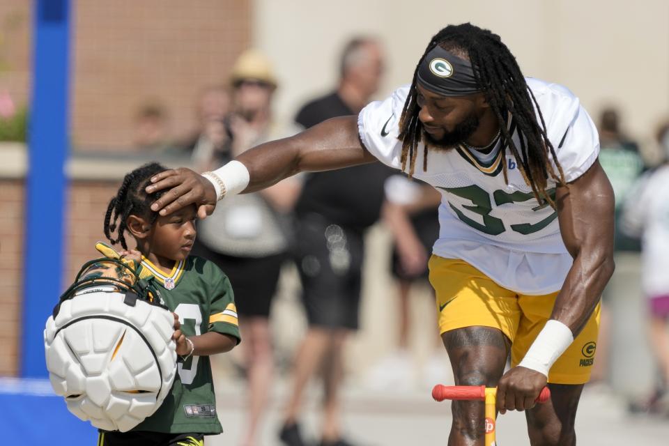 Green Bay Packers' Aaron Jones rides a scooter to NFL football training camp Thursday, July 27, 2023, in Green Bay, Wis. (AP Photo/Morry Gash)