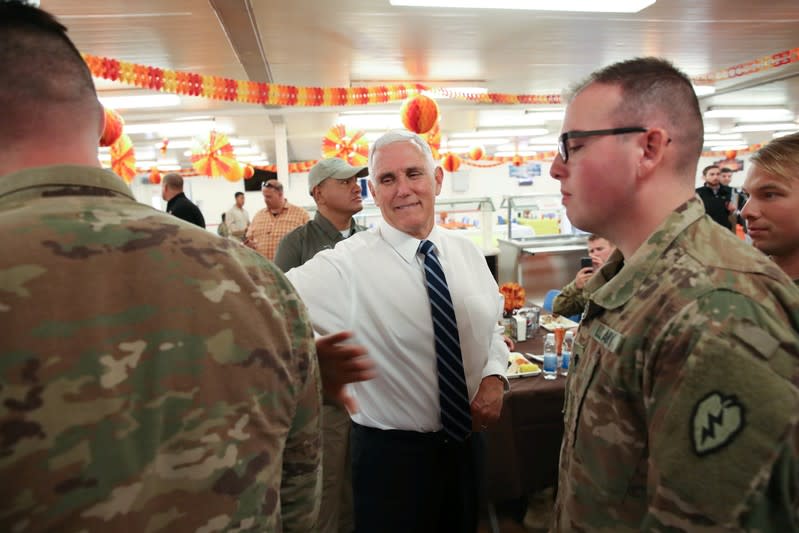 U.S. Vice President Mike Pence greets troops after helping to serve a Thanksgiving meal to U.S. troops in a dining facility at Camp Flores on Al Asad Air Base