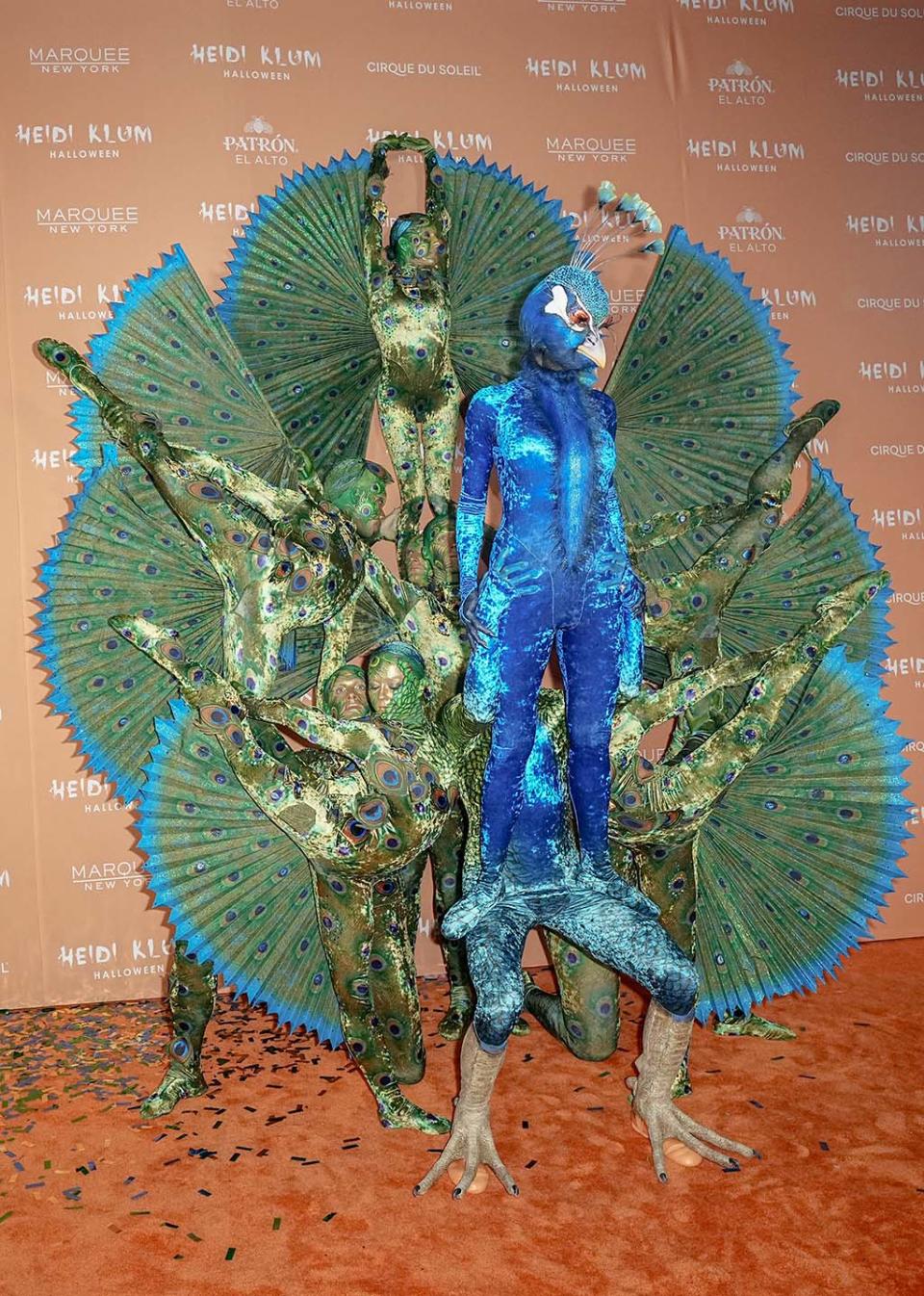 Heidi Klum Transforms Into a Peacock With FeatherPrinted Slippers for