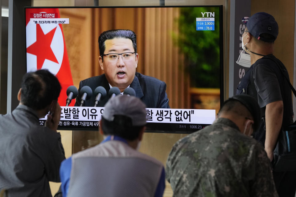 People watch a TV screen showing North Korean leader Kim Jong Un in a news program, at Seoul Railway Station in Seoul, South Korea, Thursday, Sept. 30, 2021. Kim expressed his willingness to restore stalled communication lines with South Korea to promote peace in early October, while he shrugged off recent U.S. offers for dialogue by calling them "more cunning ways" to conceal its hostility against the North, state media reported Thursday. (AP Photo/Ahn Young-joon)