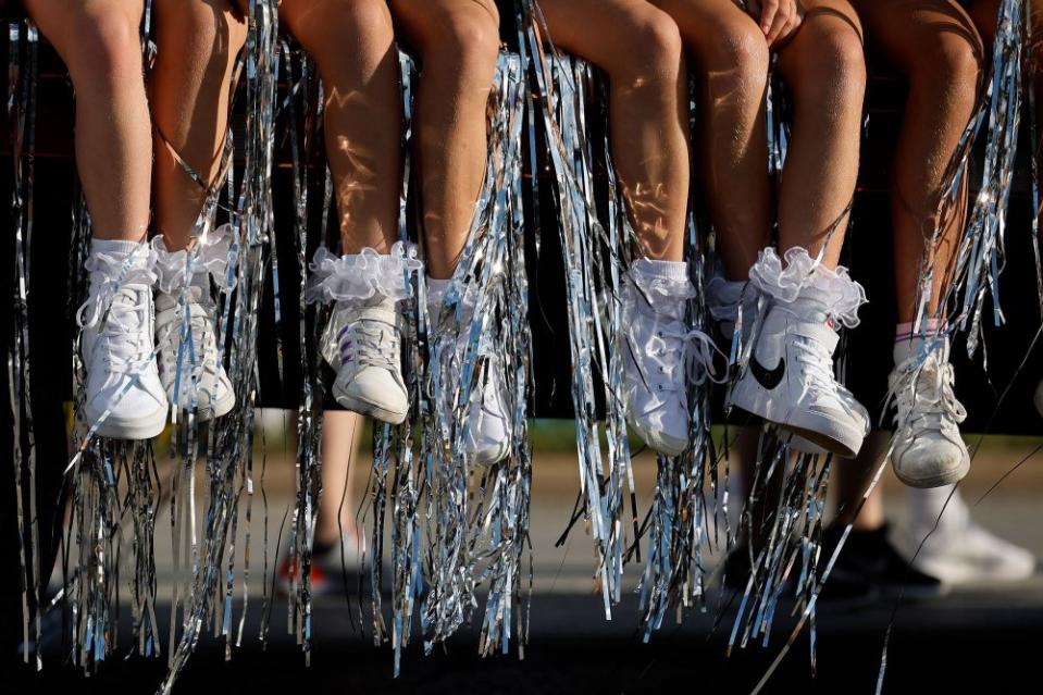 Tinsel and tennis shoes hang off the side of a float in the Iowa State Fair Kick-Off Parade along East Grand Avenue on Aug. 9.<span class="copyright">Chip Somodevilla—Getty Images</span>