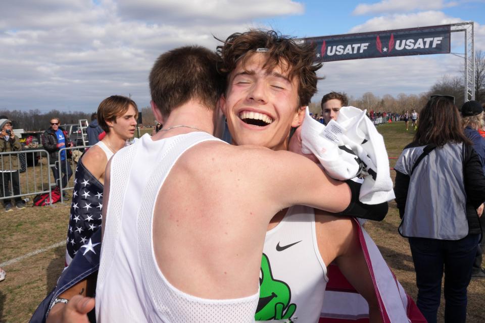 Leo Young embraces Newbury Park High teammate Brayden Seymour after winning the men's Under-20 race at the USA Cross Country Championships on Saturday in Richmond, Virginia.