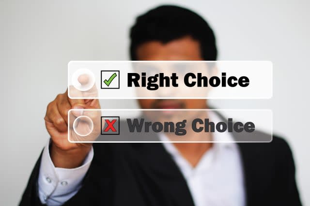 Right Choice Selected by an Young male Professional as against another Wrong Choice by clicking the button