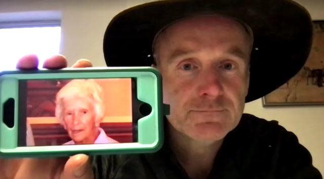 New South Wales, Australia businessman and community advocate Andrew Thaler holds up his phone showing a photo of Clare Nowland, May 19, 2023. / Credit: Reuters