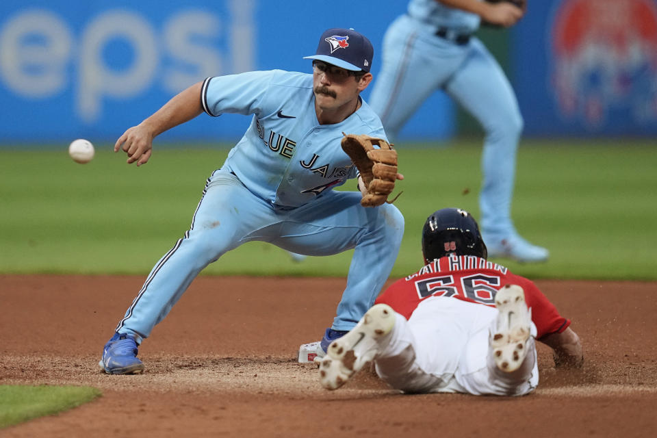 Toronto Blue Jays second baseman Davis Schneider waits for the throw, before tagging out Cleveland Guardians' Kole Calhoun on an attempted steal at second base during the fourth inning of a baseball game Wednesday, Aug. 9, 2023, in Cleveland. (AP Photo/Sue Ogrocki)