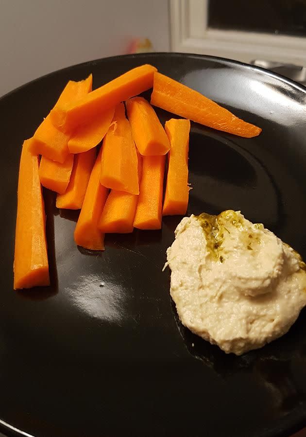 Snack of one medium carrot with four tablespoons of hummus. Photo: Sarah Carty.