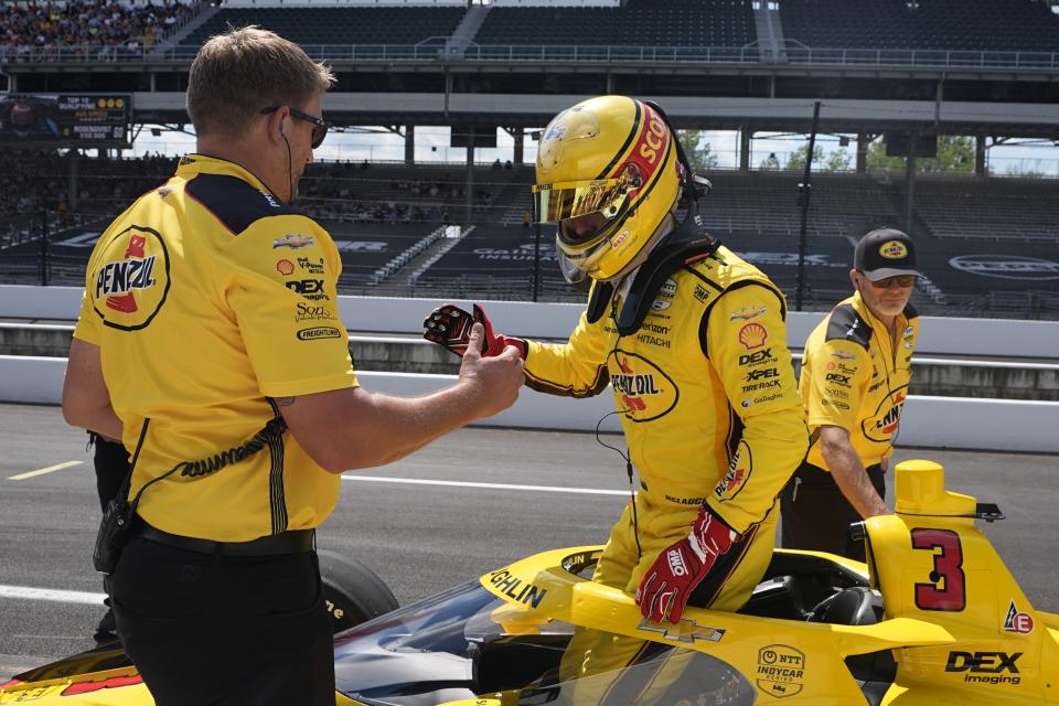 Scott McLaughlin, of New Zealand, climbs out of his car during qualifications for the Indianapolis 500 auto race at Indianapolis Motor Speedway, Sunday, May 19, 2024, in Indianapolis. (AP Photo/Darron Cummings)