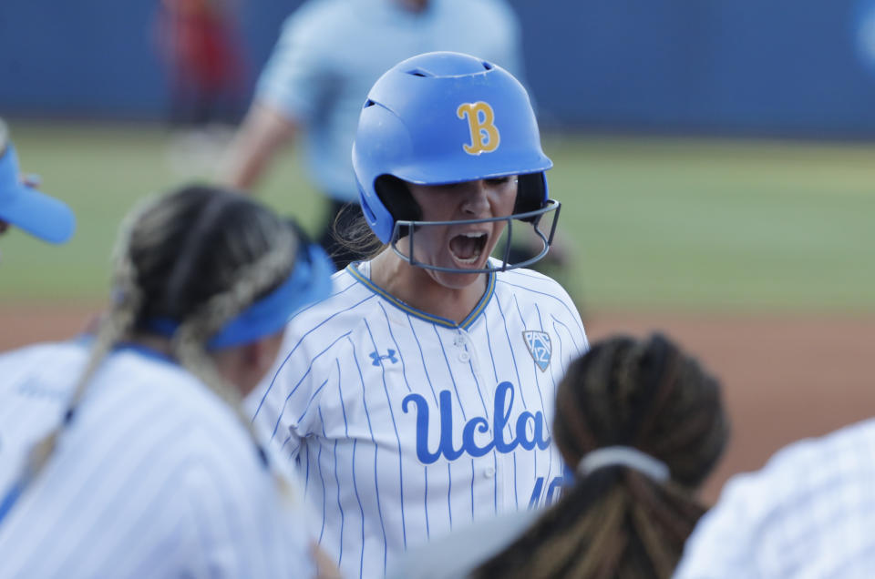 UCLA's Bubba Nickles celebrates after hitting a home run against Oklahoma during the first inning of Game 2 of the best-of-three championship series in the NCAA softball Women's College World Series in Oklahoma City, Tuesday, June 4, 2019. (AP Photo/Alonzo Adams)