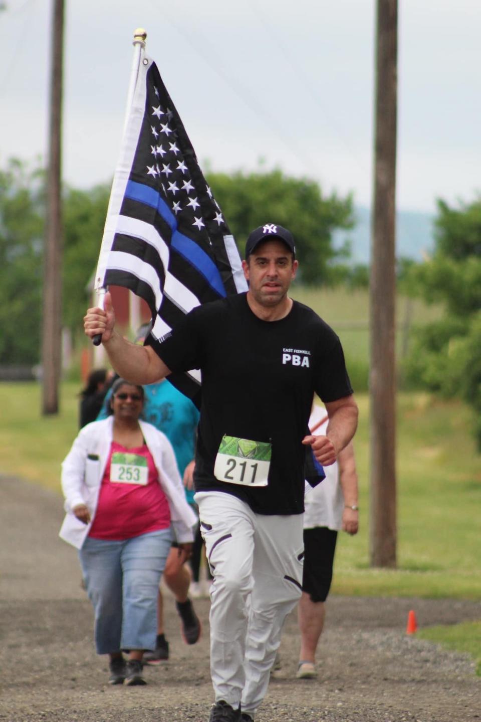 Officer Daniel P. DiDato at the Superhero 5K run for Sparrow's Nest at Barton Orchards in Poughquag on June 3, 2023.
