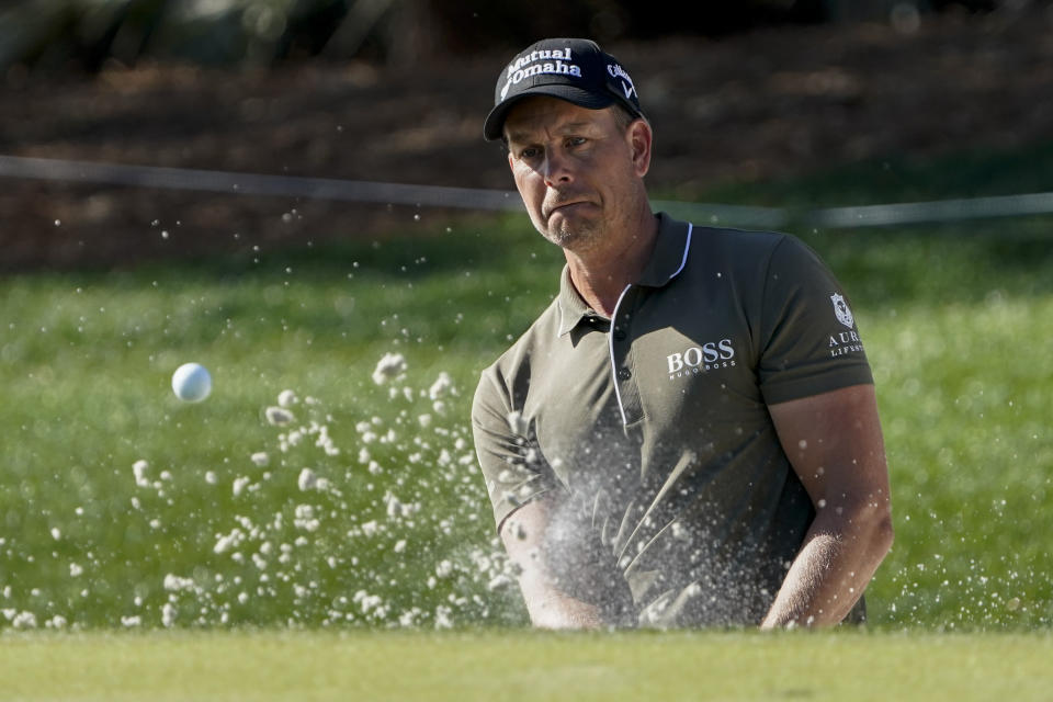 Henrik Stenson of Sweden, watches his bunker shot on the ninth hole during the first round of the The Players Championship golf tournament Thursday, March 11, 2021, in Ponte Vedra Beach, Fla. (AP Photo/John Raoux)