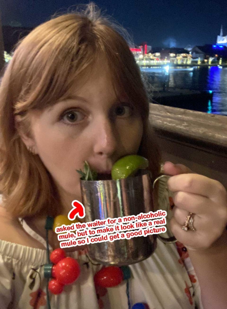 the author with a beverage and the words "asked the waiter for a non-alcoholic mule, but to make it look like a real mule so I could get a good picture"