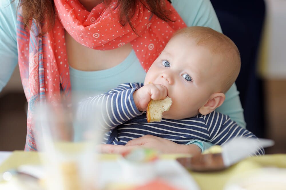 baby eating bread