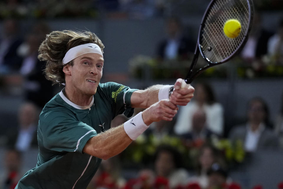 Andrey Rublev, of Russia, returns the ball to Felix Auger-Aliassime, of Canada, during the final match of the Madrid Open tennis tournament in Madrid, Spain, Sunday, May 5, 2024. (AP Photo/Manu Fernandez)