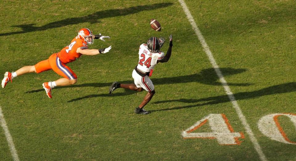 South Carolina defensive back Marcellas Dial (24) intercepts a pass in front of Clemson tight end Davis Allen (84) during fourth-quarter action in Clemson, S.C. on Saturday, Nov. 26, 2022.