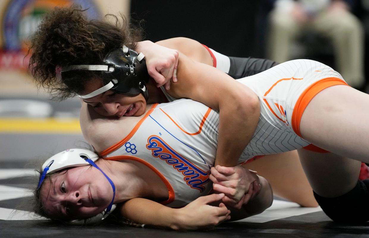 Mar 10, 2024; Columbus, Ohio, USA; Olentangy Orange Mackenzie Carder wrestles Steubenville Talea Guntrum in the 110 weight class during the Ohio State Wrestling Final round at Value City Arena.