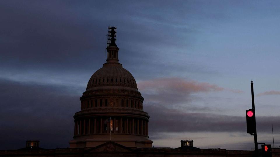 PHOTO: The morning sky brightens over the U.S. Capitol in Washington, September 28, 2023. (Jonathan Ernst/Reuters)