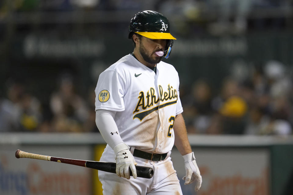 Oakland Athletics' Shea Langeliers walks to the dugout after striking out against the New York Yankees during the sixth inning of a baseball game in Oakland, Calif., Friday, Aug. 26, 2022. (AP Photo/Jeff Chiu)