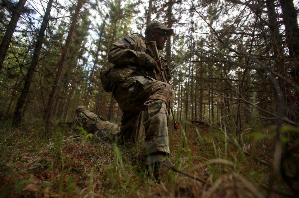 Jason Van Tatenhove, a member of the Oath Keepers, participates in a tactical training session in western Montana, U.S. April 30, 2016 while dressed from head-to-toe in camouflage gear and toting a rifle.