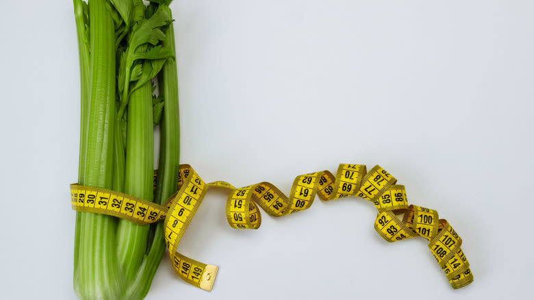 Celery bunch with measuring tape