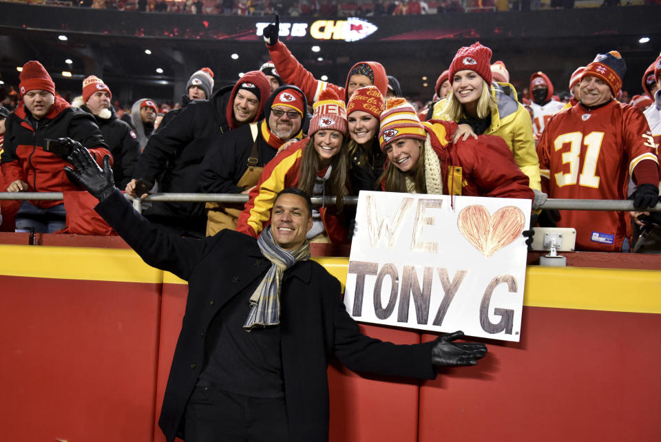 FILE - In this Dec. 13, 2018, file photo, former Kansas City Chiefs player Tony Gonzalez poses with fans in the stands after he was inducted to the Chiefs Hall fo Fame, at halftime of the team's NFL football game against the Los Angeles Chargers in Kansas City, Mo. After 17 seasons in the NFL and several years as a broadcaster, Gonzalez stepped away from the studio this season to pursue acting. (AP Photo/Ed Zurga, File)