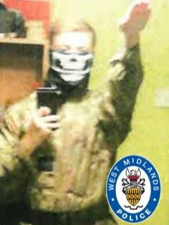Paul Dunleavy performing a Hitler salute and wearing combat fatigues (West Midlands Police)