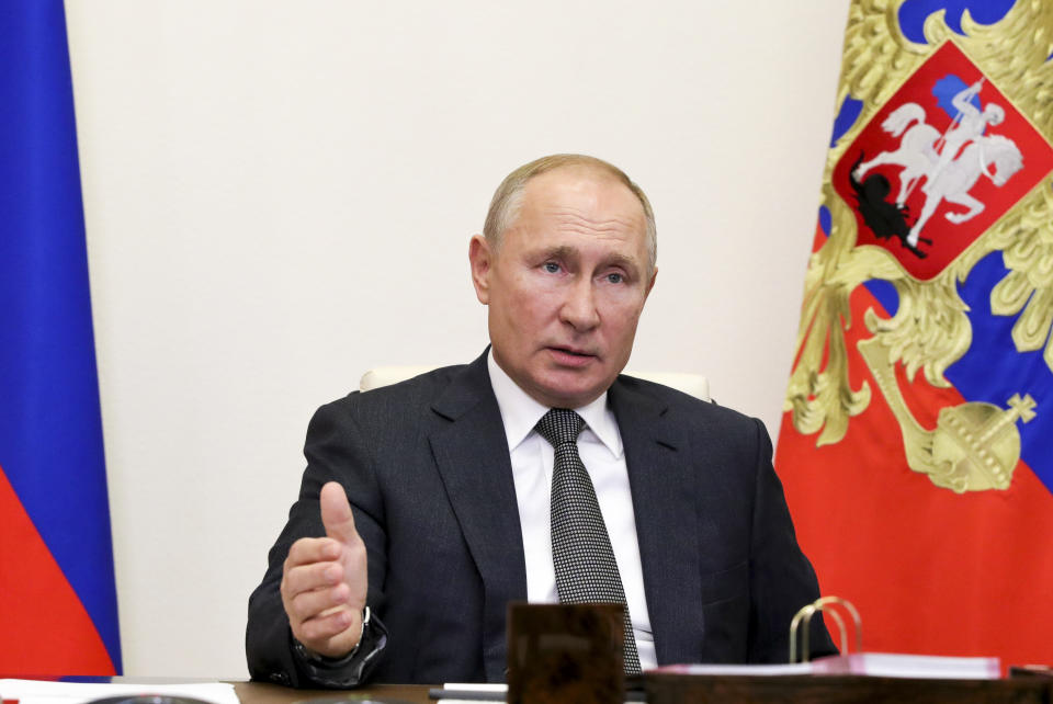 Russian President Vladimir Putin gestures during a meeting with elected heads of Russian regions via video conference at the Novo-Ogaryovo residence outside Moscow, Russia, Thursday, Sept. 24, 2020. Russian health officials have reported 6,595 new coronavirus cases, the highest daily surge since July. In Moscow, more than 1,000 new cases were recorded Thursday for the first time since June. (Mikhail Klimentyev, Sputnik, Kremlin Pool Photo via AP)