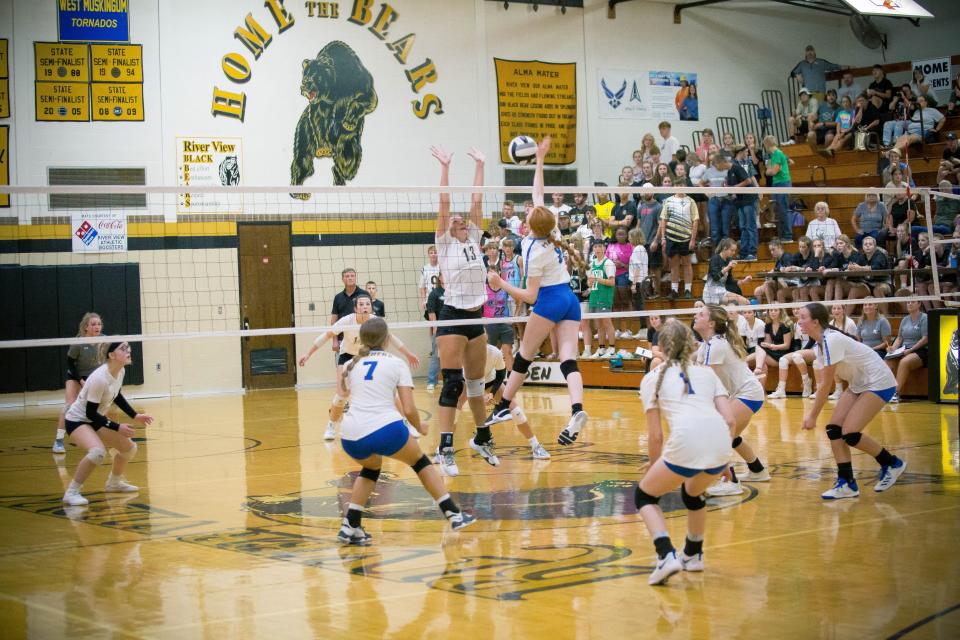 Maysville's Sailor Atkins hits a kill against River View's Alivia Spaulding in Thursday's match. The Lady Bears won in three sets.