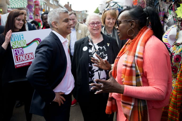 Labour party candidate for London Mayor Sadiq Khan's (L) modest background plays well in a city that is proud of its diversity and loves a self-made success story