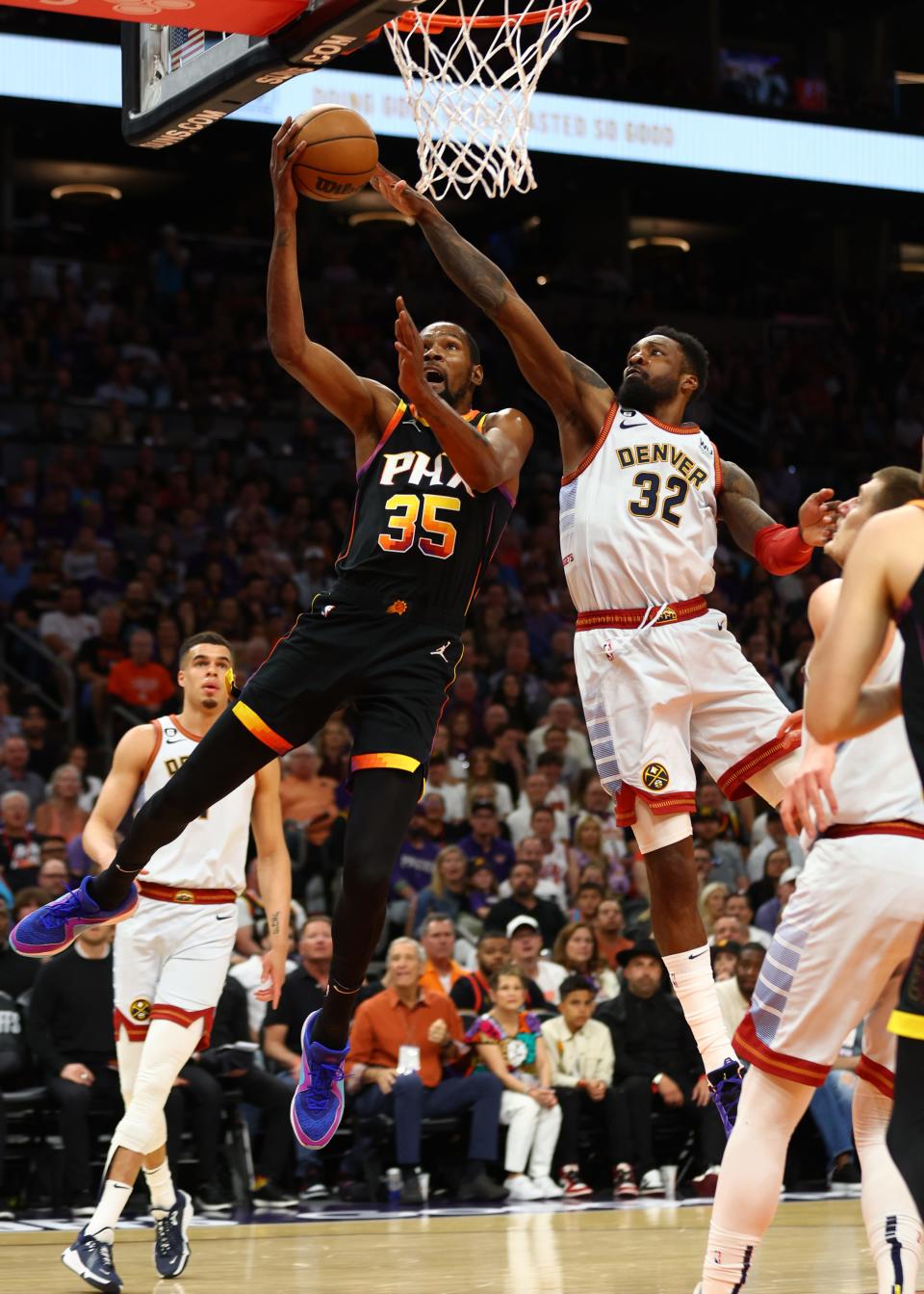 May 5, 2023; Phoenix, Arizona, USA; Phoenix Suns forward Kevin Durant (35) drives to the basket against Denver Nuggets forward Jeff Green (32) in the first half during game three of the 2023 NBA playoffs at Footprint Center. Mandatory Credit: Mark J. Rebilas-USA TODAY Sports
