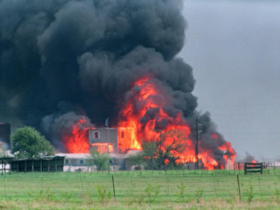 The Branch Davidian compound in flames in 1993 after a shootout following a 51-day siege with federal law enforcement near Waco, Texas; 76 sect members died inside. (AFP/Getty Images)