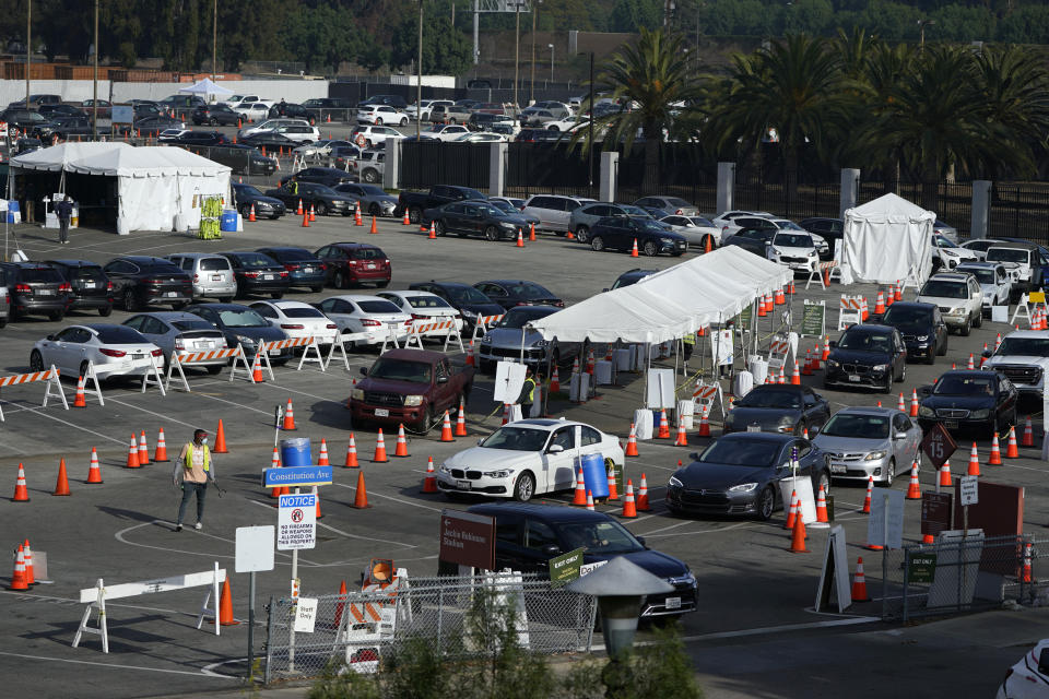 Motorists line up to take a COVID-19 test Tuesday, Jan. 5, 2021, in Los Angeles. (AP Photo/Marcio Jose Sanchez)