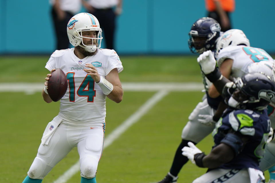 Miami Dolphins quarterback Ryan Fitzpatrick (14) looks to pass the ball during the first half of an NFL football game against the Seattle Seahawks, Sunday, Oct. 4, 2020 in Miami Gardens, Fla. (AP Photo/Wilfredo Lee)