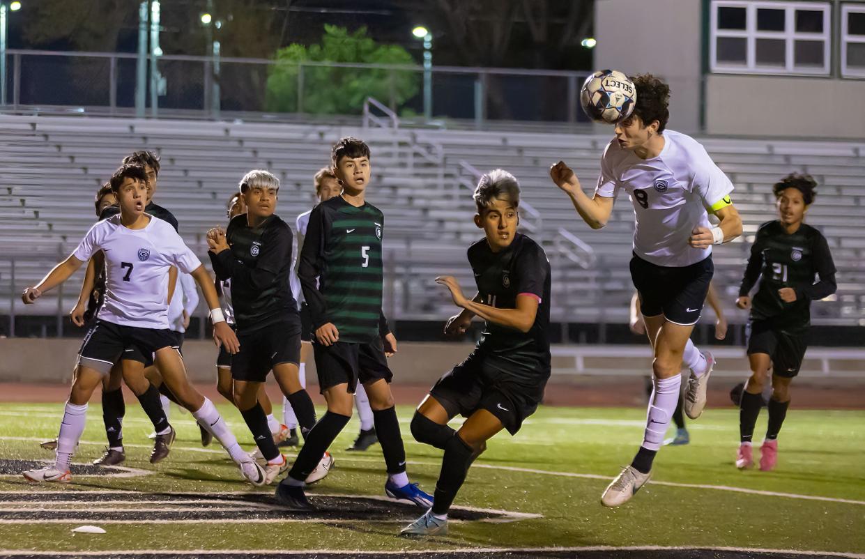 Georgetown Eagles defender Henry Seigman (8) attempts a failed header to score against the Connally Cougars during the second half at the District 23-5A boys soccer game on Feb 16, 2024, at Connally High School in Pflugerville, TX.