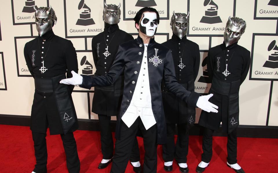Ghost arrive at the 58th Grammy awards ceremony - Getty
