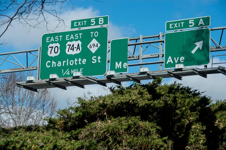 A portion of the Merrimon Avenue exit sign on I-240 was missing November 28, 2022.