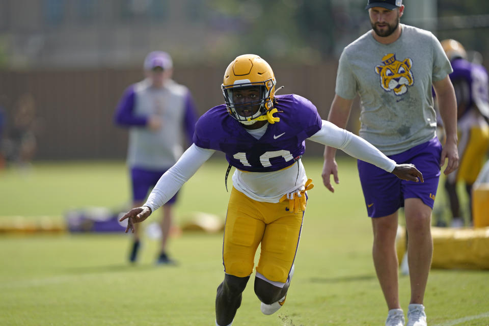 FILE - LSU linebacker Harold Perkins (10) runs through drills during their NCAA college football practice in Baton Rouge, La., Wednesday, Aug. 17, 2022. Harold Perkins was named to The Associated Press preseason All-America team, Monday, Aug. 21, 2023. (AP Photo/Gerald Herbert, File)