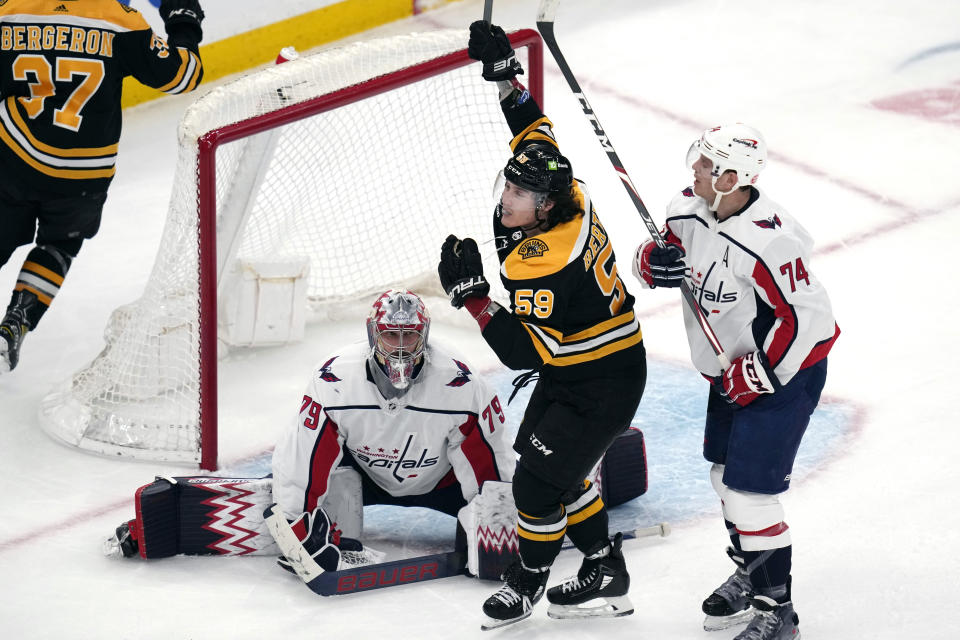 Boston Bruins left wing Tyler Bertuzzi (59) celebrates his goal against Washington Capitals goaltender Charlie Lindgren (79) during the second period of an NHL hockey game Tuesday, April 11, 2023, in Boston. (AP Photo/Charles Krupa)