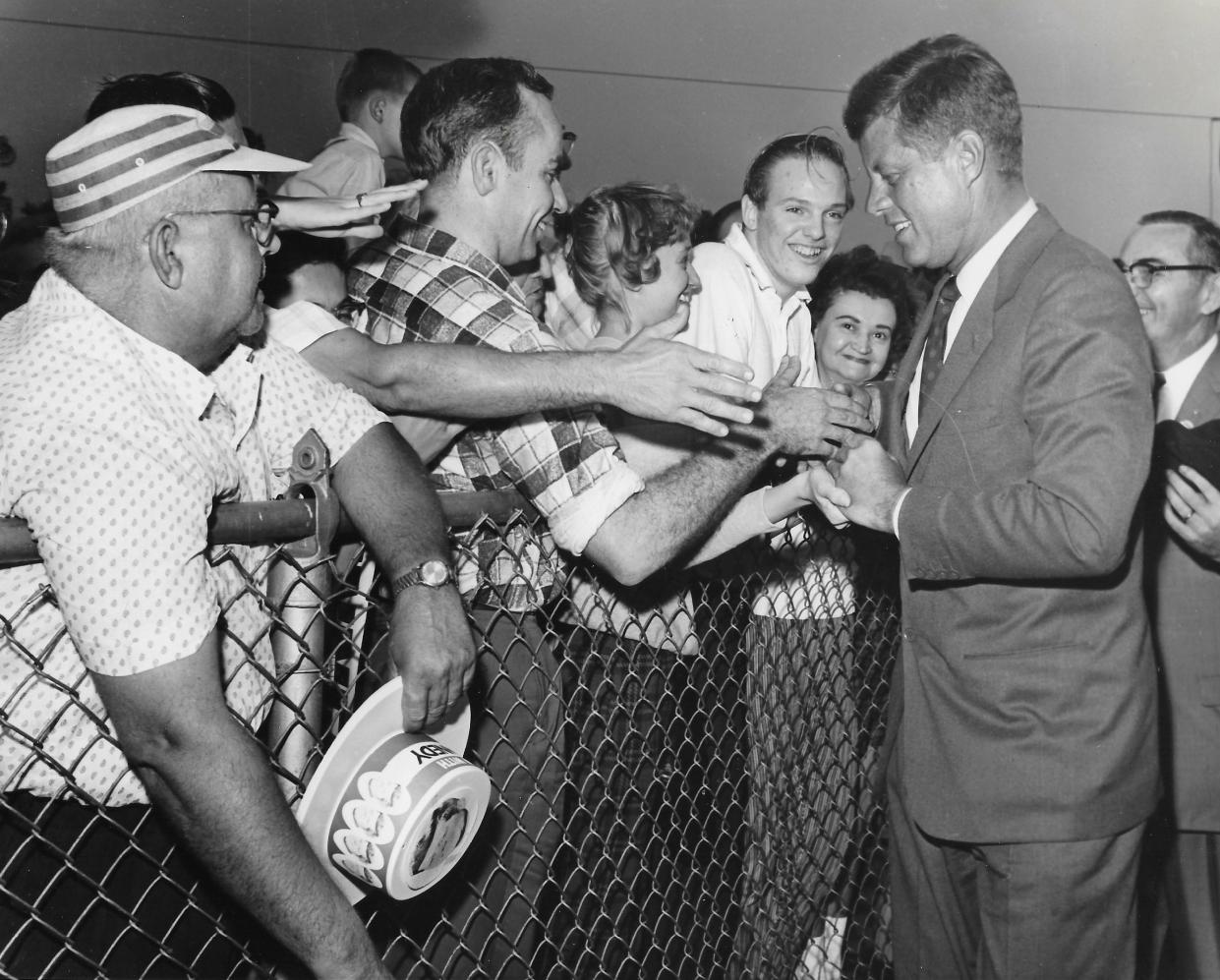 U.S. Sen. John F. Kennedy shakes hands with supporters after landing at Akron Municipal Airport for a campaign visit Sept. 27, 1960.