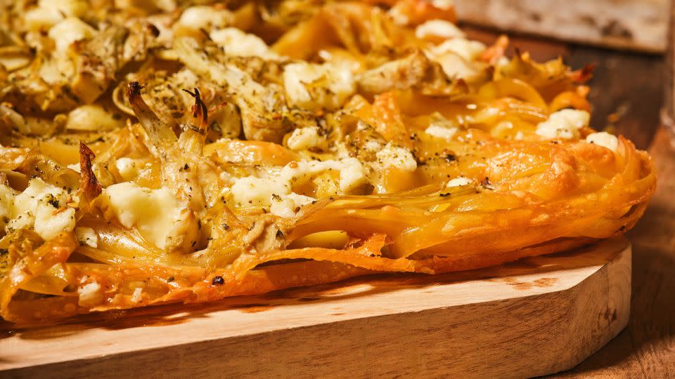Artichokes, feta and the Middle Eastern seasoning mix za’atar are among the toppings on this pasta pizza. - Dan Liberti