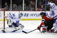 Toronto Maple Leafs goaltender Matt Murray (30) makes a save in front of New Jersey Devils left wing Tomas Tatar during the second period of an NHL hockey game Wednesday, Nov. 23, 2022, in Newark, N.J. (AP Photo/Adam Hunger)