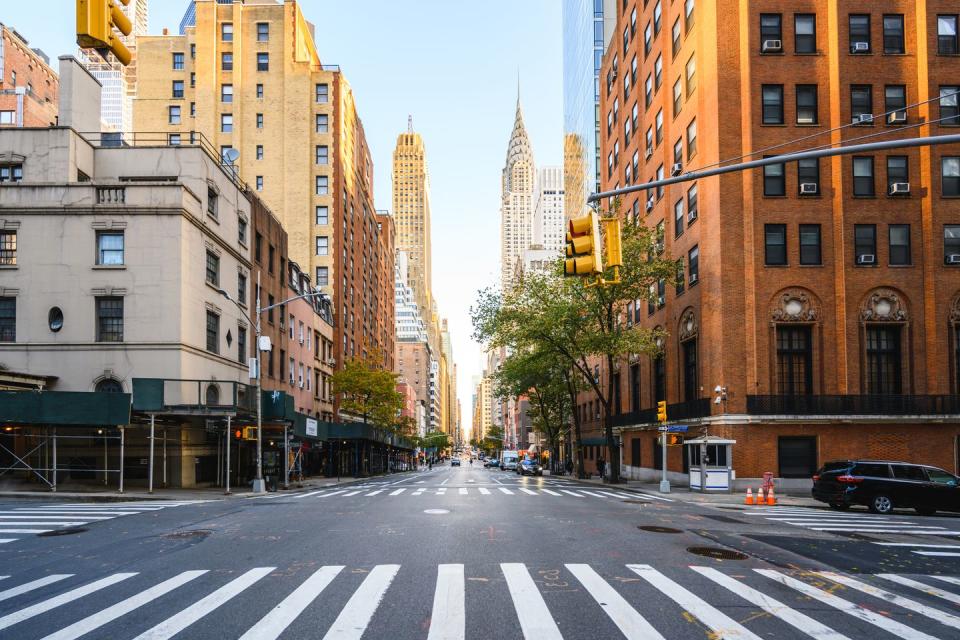 street in manhattan downtown with crysler building, new york city, usa