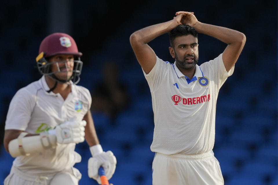 India's bowler Ravichandran Ashwin gestures as West Indies' Tagenarine Chanderpaul, left, runs on day four of their second cricket Test match at Queen's Park in Port of Spain, Trinidad and Tobago, Sunday, July 23, 2023. (AP Photo/Ricardo Mazalan)
