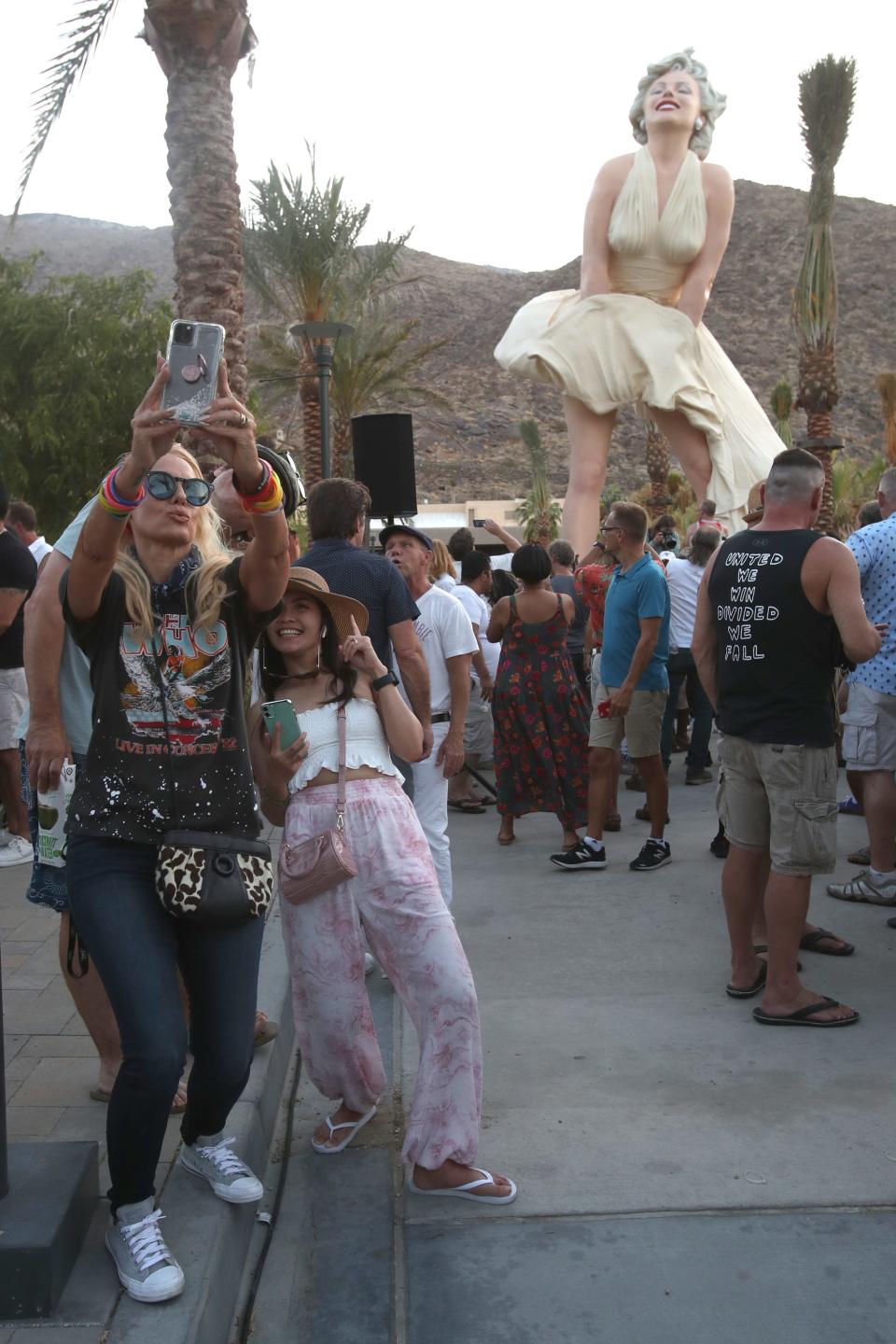 Celeste Octavia, left, and Mae Duvernay of Los Angeles take a selfie with the "Forever Marilyn" statue in downtown Palm Springs on June 20, 2021.