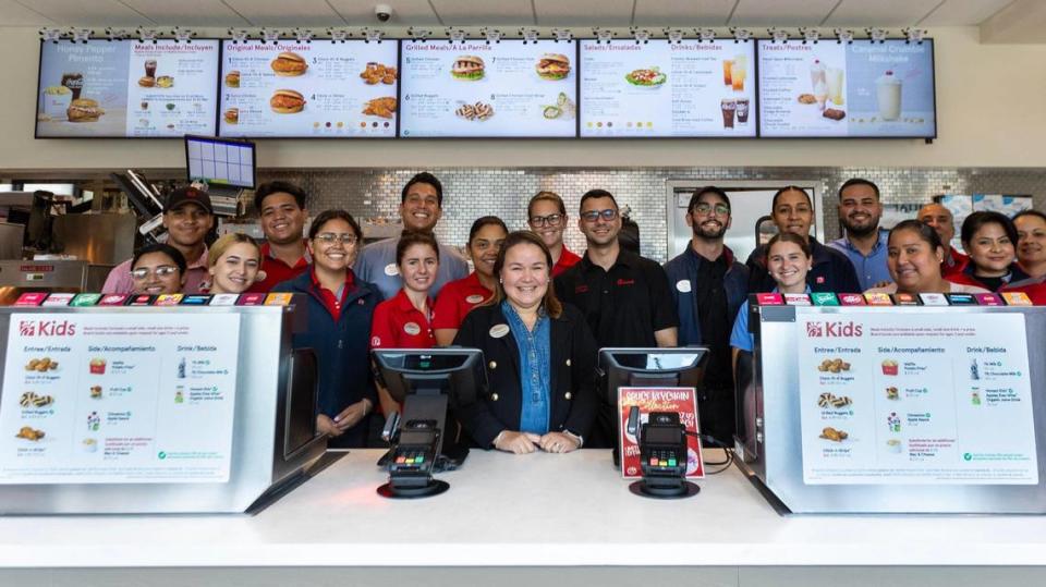 Cynthia Bowles, owner of the first Chick-fil-A in Hialeah, stands behind the restaurant counter on Sept. 14, 2023 with some of her team.